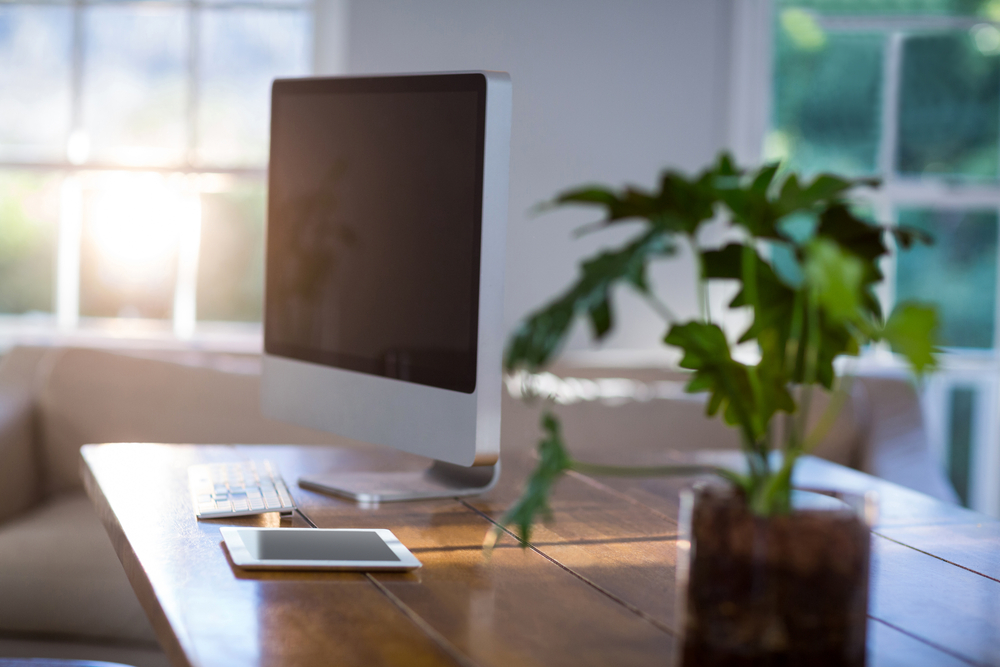 Computer and digital tablet on a table at home